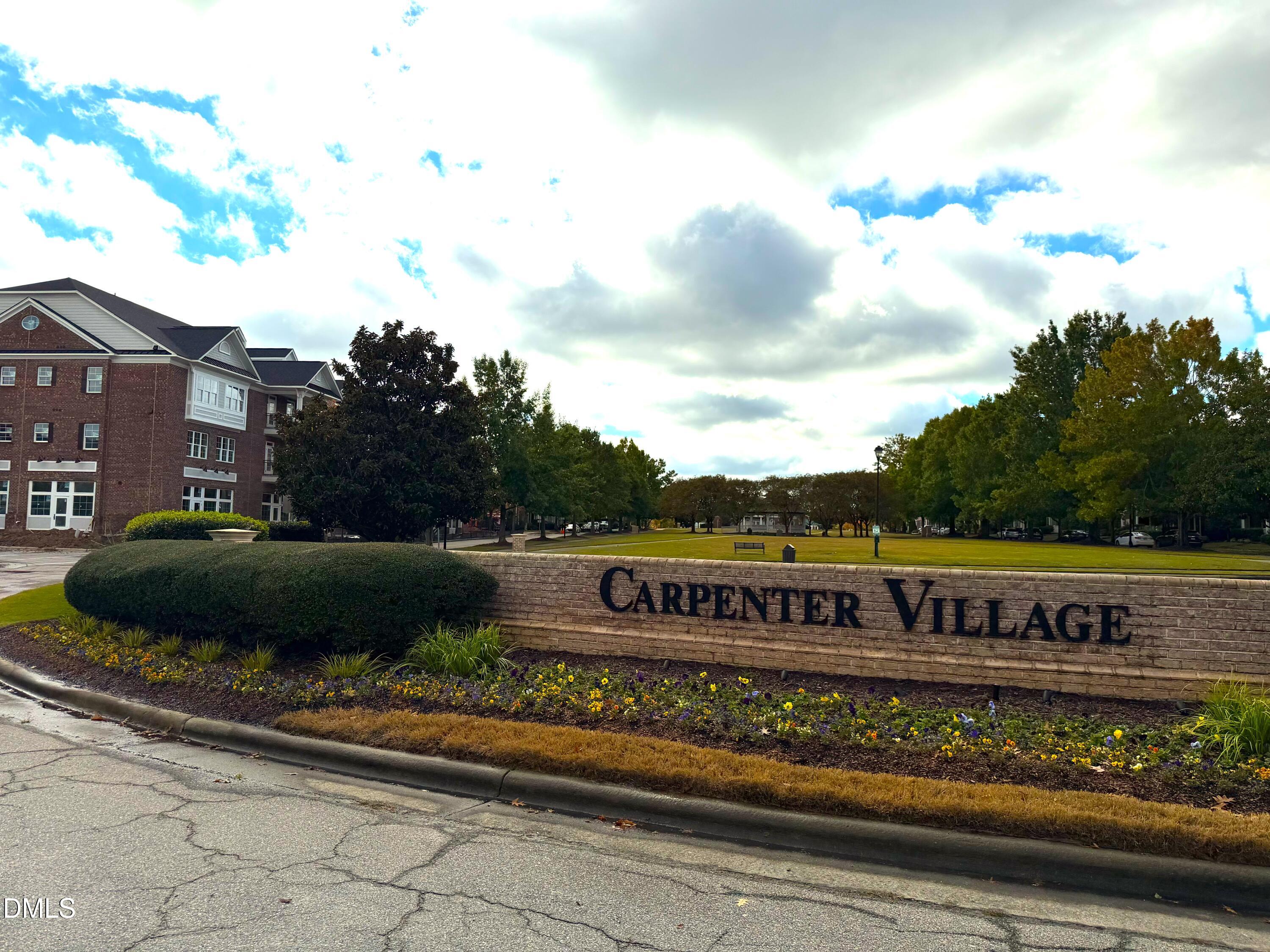 200 Madison Grove Place Cary, NC 27519 - Photo 29 of 49 a sign that is sitting on a brick wall