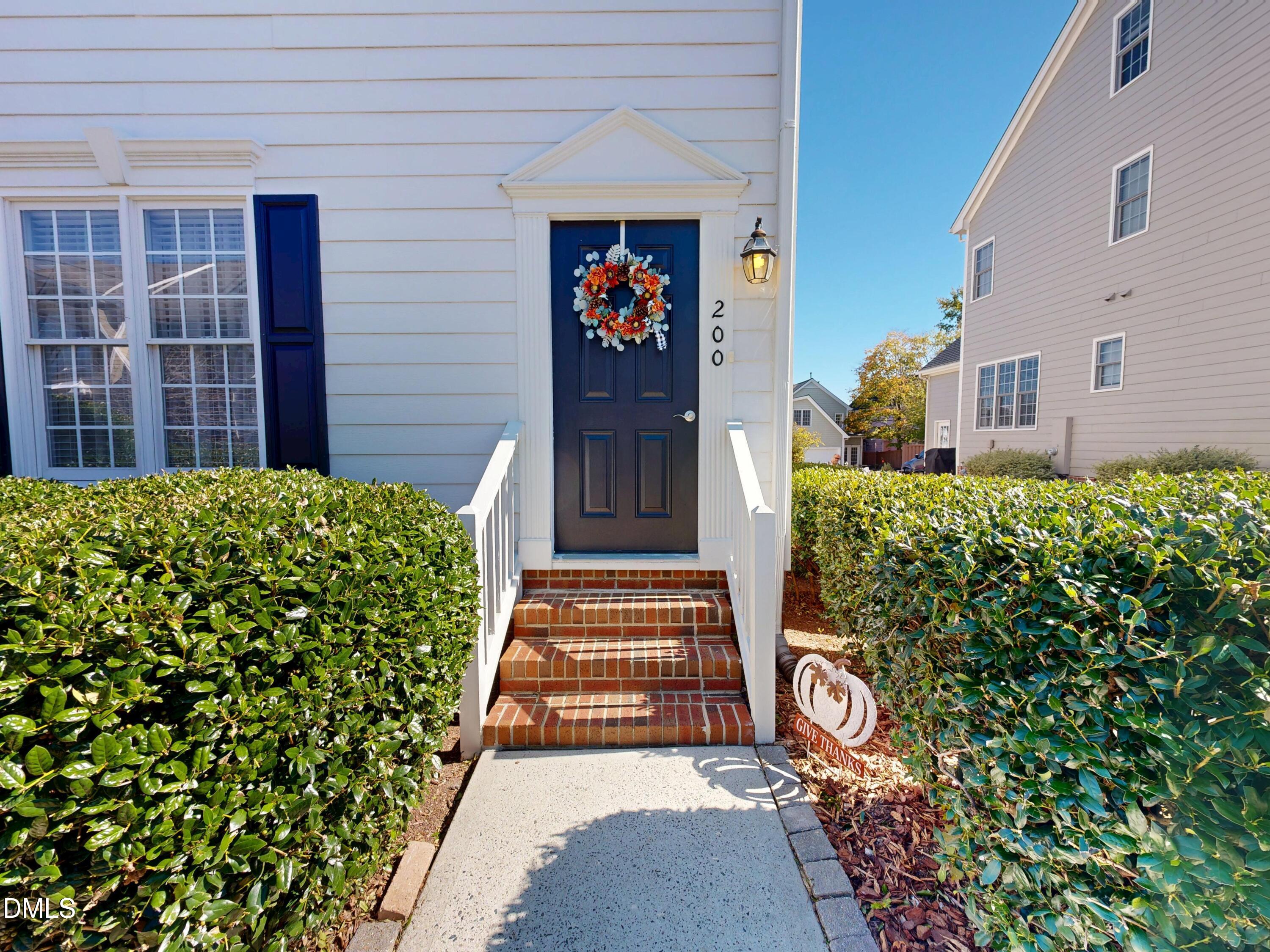 200 Madison Grove Place Cary, NC 27519 - Photo 2 of 49 a view of a house with potted plants
