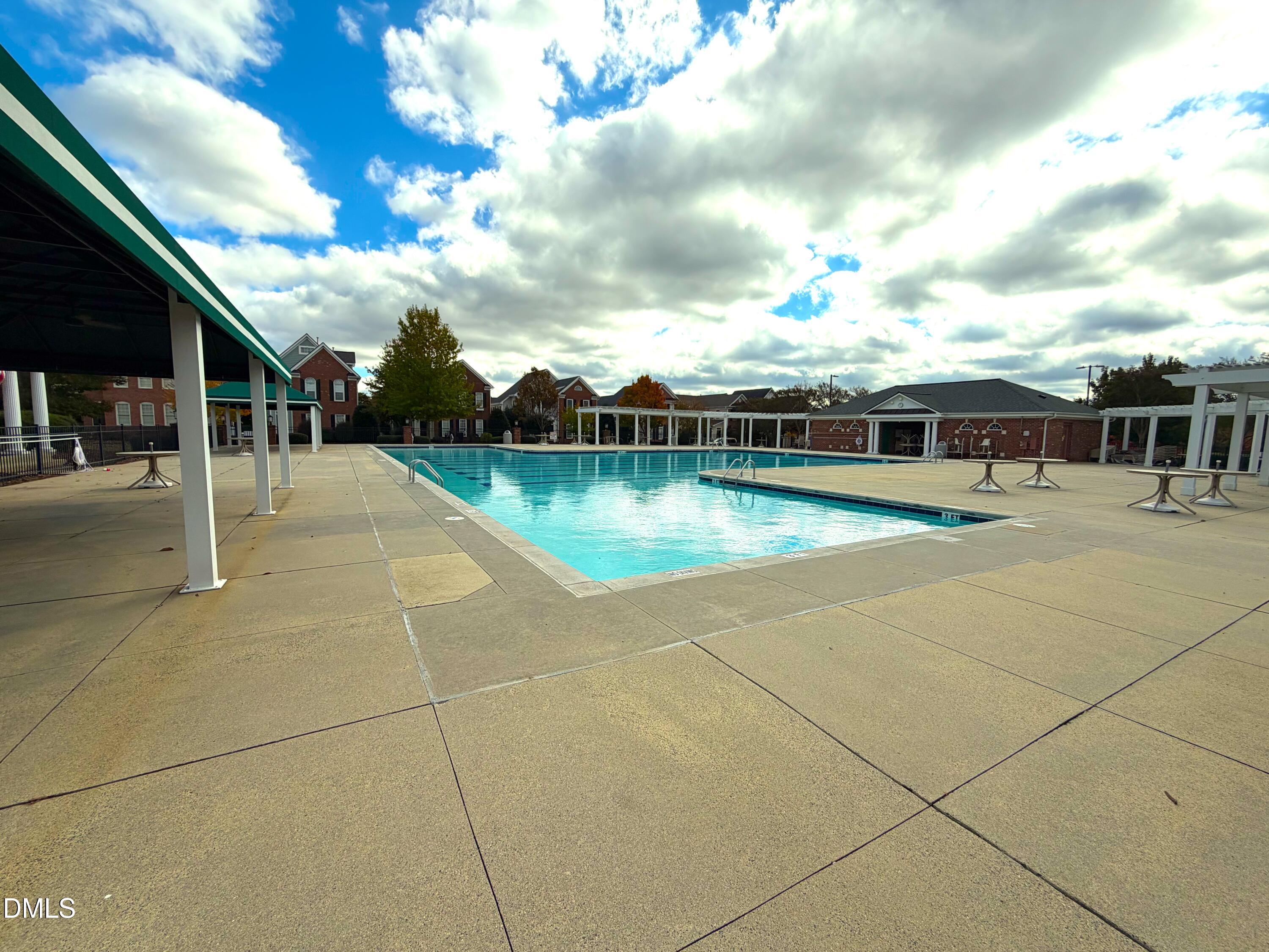200 Madison Grove Place Cary, NC 27519 - Photo 32 of 49 a view of a swimming pool with an outdoor seating