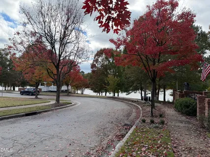 a view of a yard covered with snow in front of house