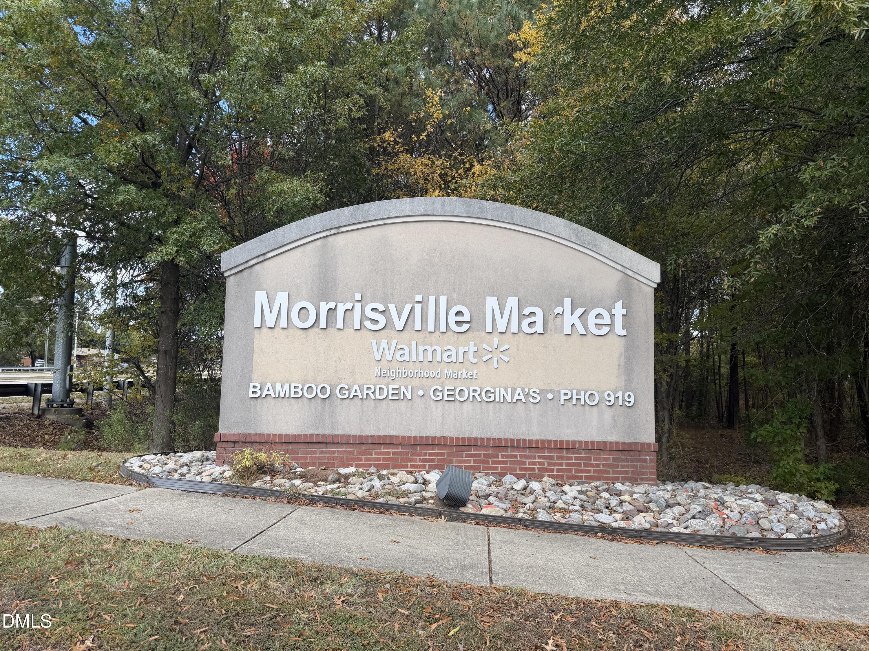 200 Madison Grove Place Cary, NC 27519 - Photo 47 of 49 a sign on the side of a road