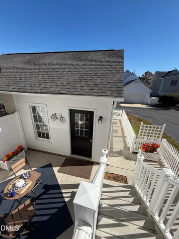a view of a porch with furniture and a window