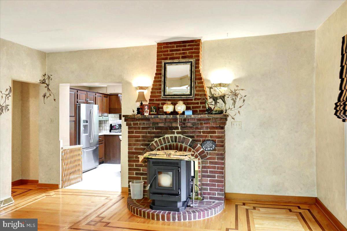 126 West Neversink Road Reading, PA 19606 - Photo 14 of 40 Cozy brick fireplace as a focal point.
