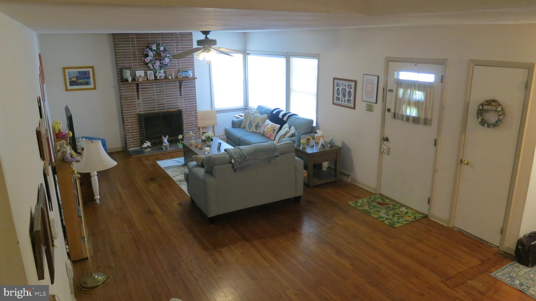 79 Ewingville Road Ewing, NJ 08638 - Photo 29 of 67 a living room with furniture and a fireplace
