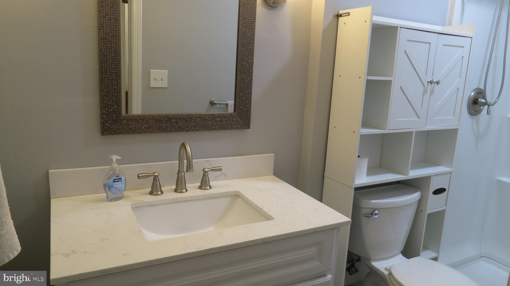 79 Ewingville Road Ewing, NJ 08638 - Photo 32 of 67 a bathroom with a sink toilet and mirror