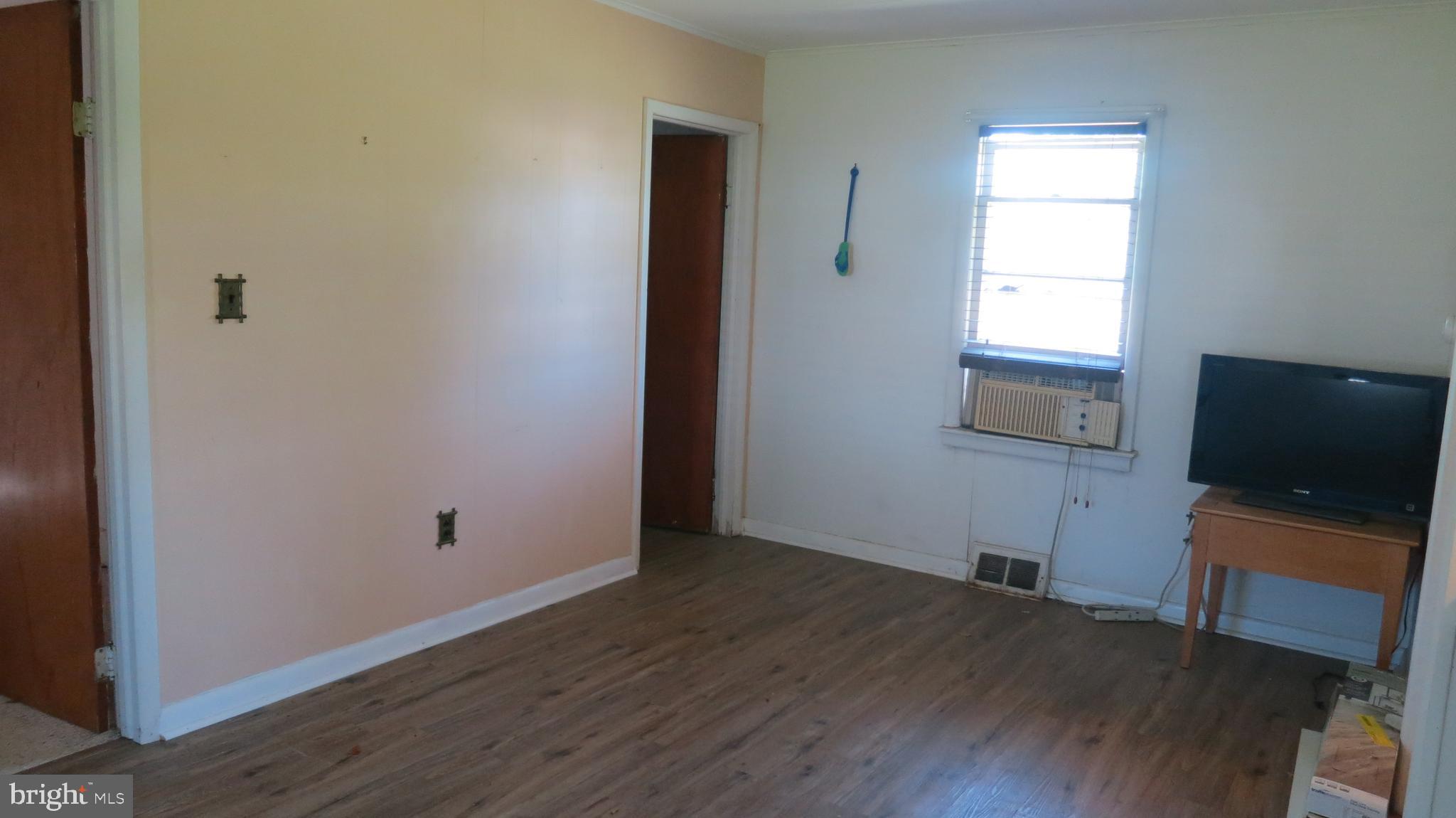 79 Ewingville Road Ewing, NJ 08638 - Photo 53 of 67 an empty room with wooden floor cabinet and mirror