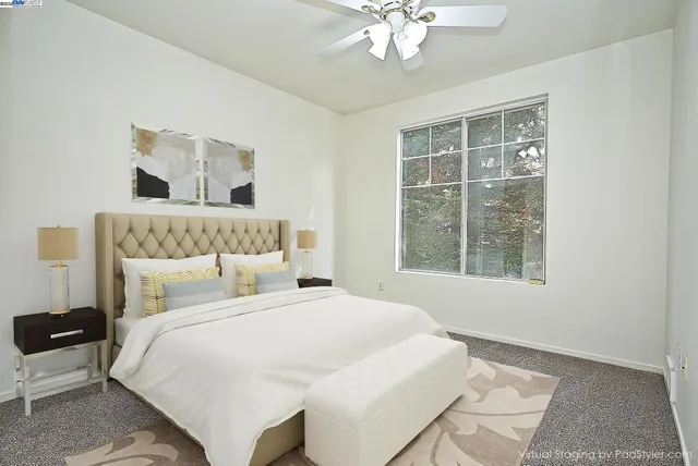 a bedroom with a large bed and a window