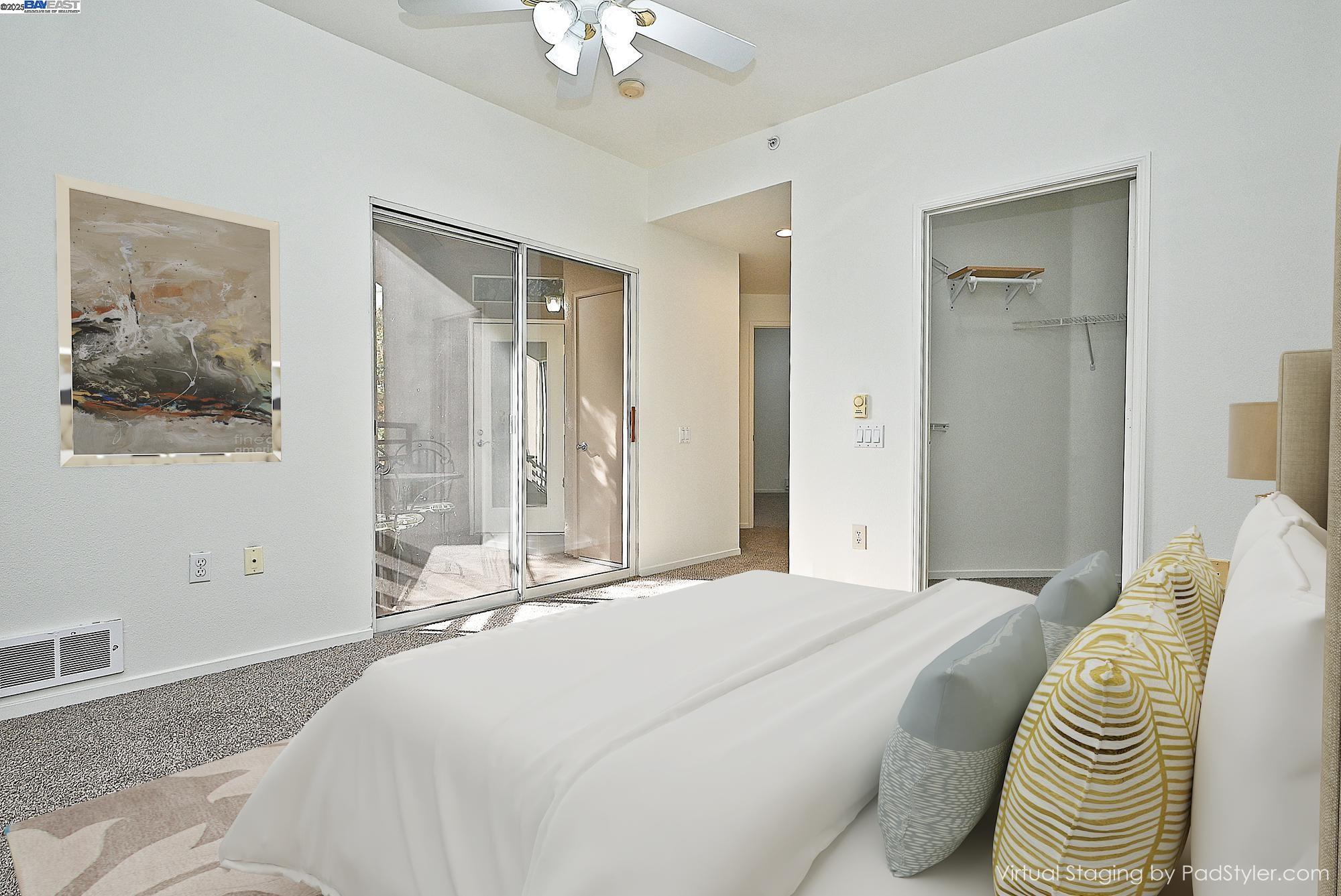 280 Caldecott Lane, Unit 221 Oakland, CA 94618 - Photo 14 of 31 a bedroom with a bed and a chandelier