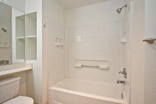 a view of a chairs and table in the balcony