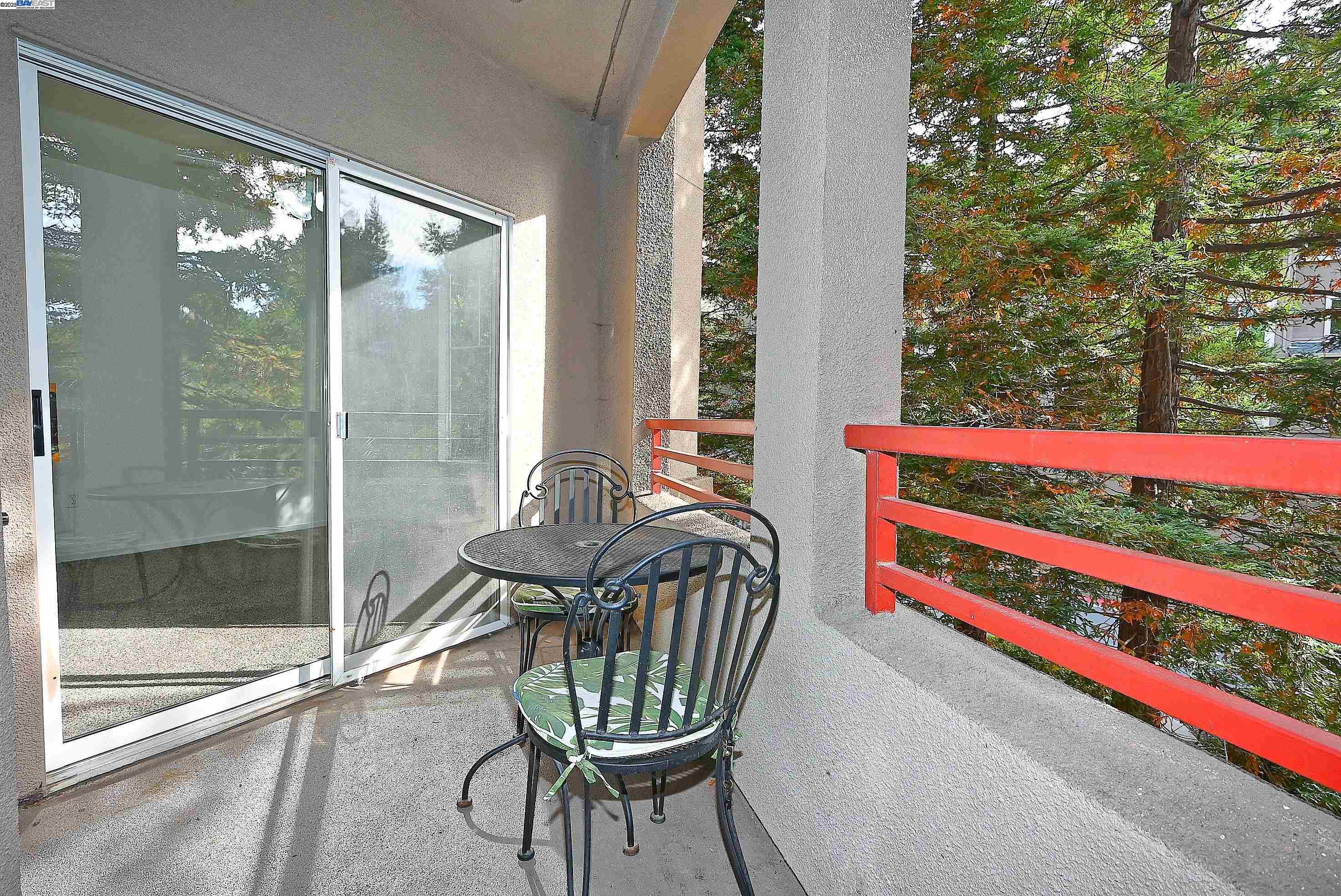 280 Caldecott Lane, Unit 221 Oakland, CA 94618 - Photo 21 of 31 a view of a balcony with chair and table