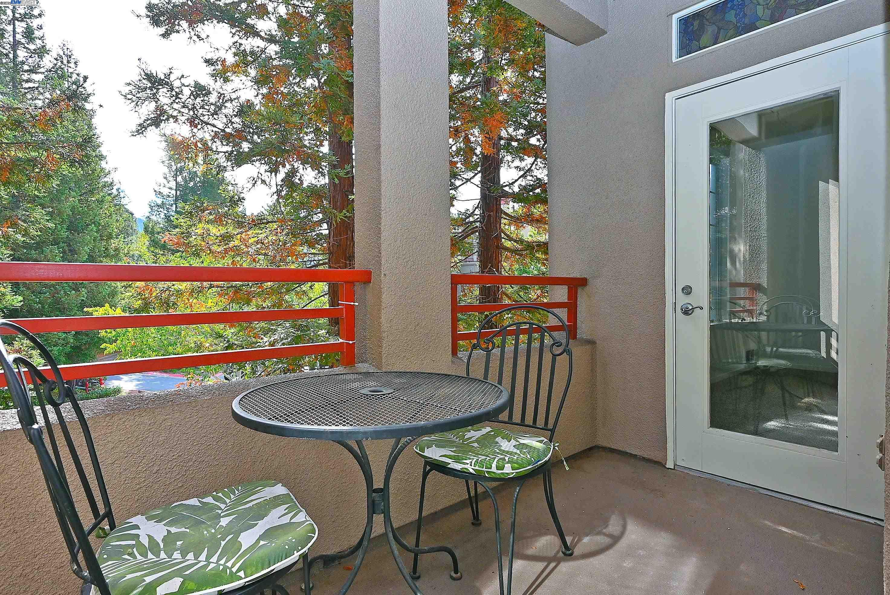 280 Caldecott Lane, Unit 221 Oakland, CA 94618 - Photo 23 of 31 a view of a chairs and table in the balcony