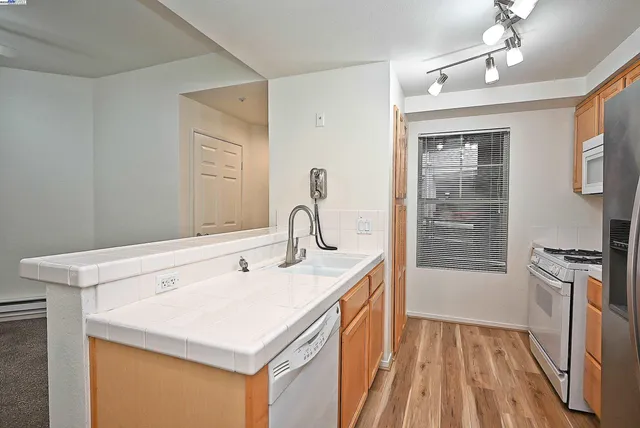 a kitchen that has a sink and a stove