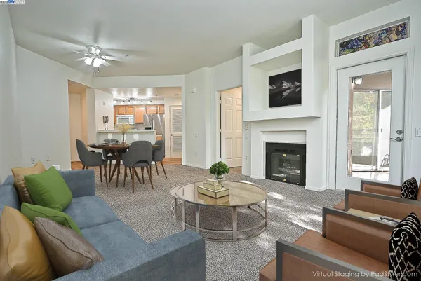 a kitchen with granite countertop cabinets stainless steel appliances and a window