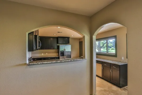 a kitchen with a refrigerator stove and microwave