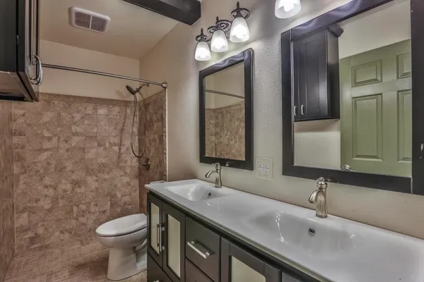 a bathroom with a sink and shower