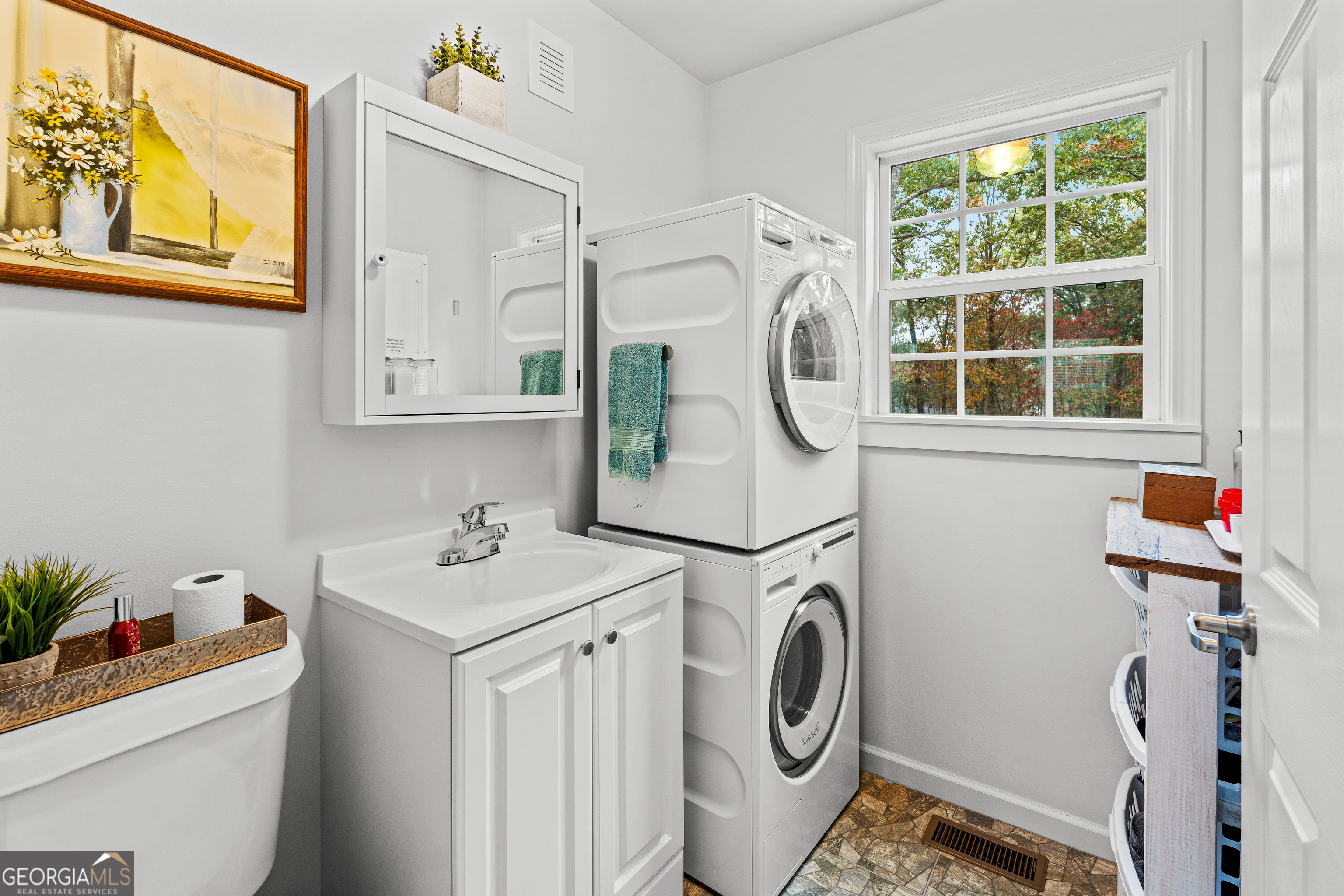 91 Rosemary Way Buchanan, GA 30113 - Photo 14 of 38 a utility room with dryer washer and a window