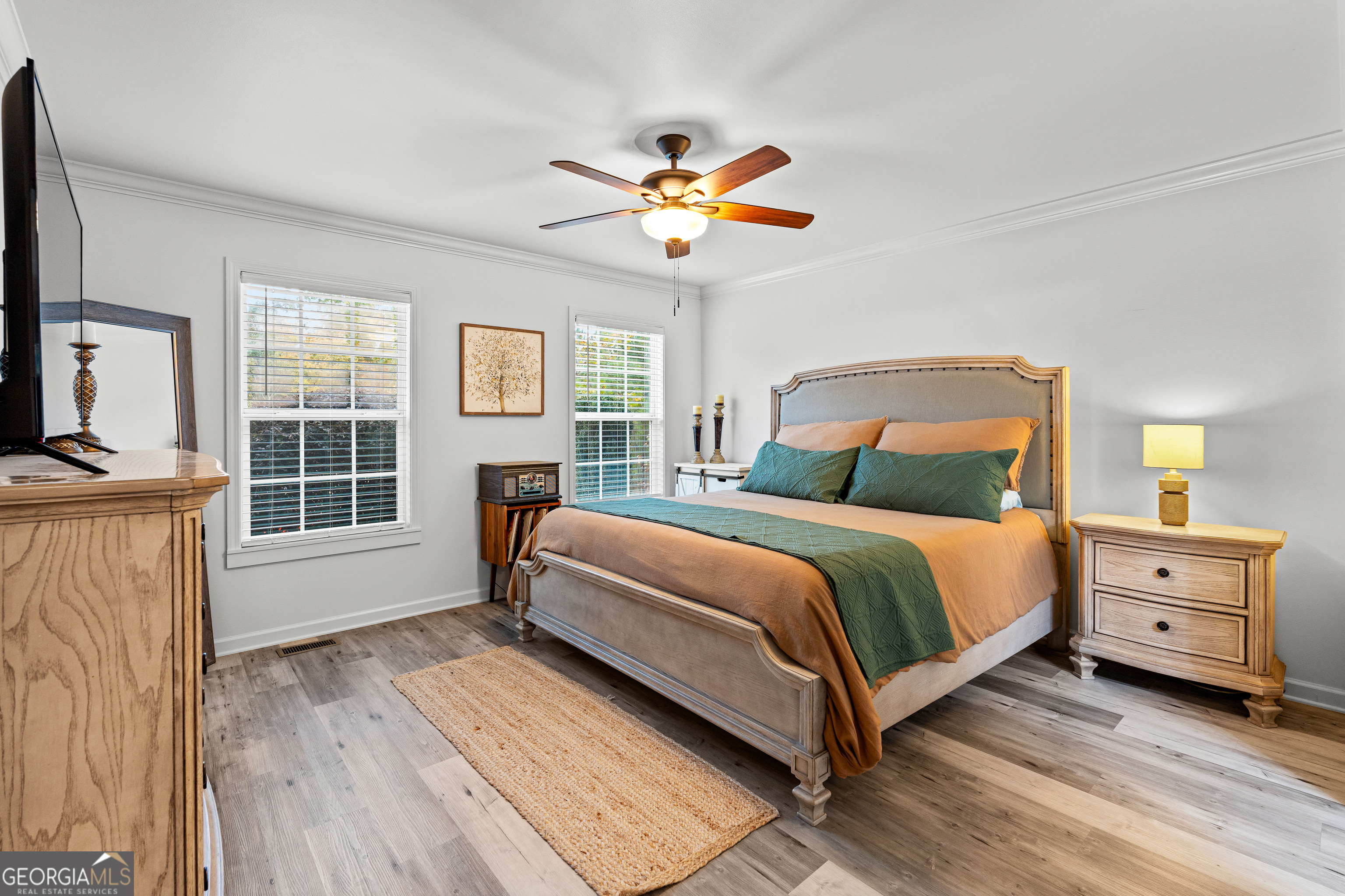 91 Rosemary Way Buchanan, GA 30113 - Photo 15 of 38 a bedroom with a bed and a chandelier