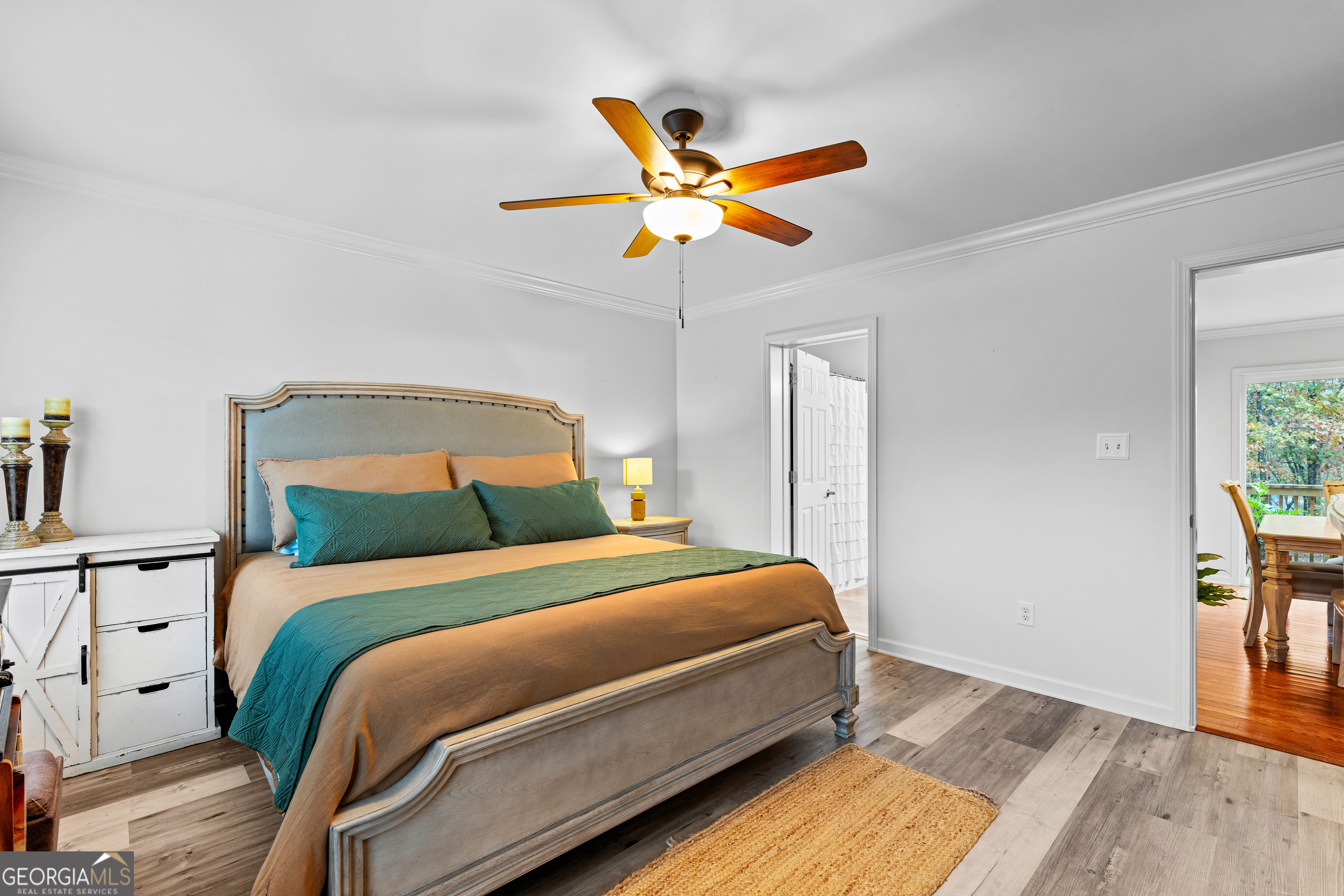 91 Rosemary Way Buchanan, GA 30113 - Photo 17 of 38 a bedroom with a bed and a chandelier