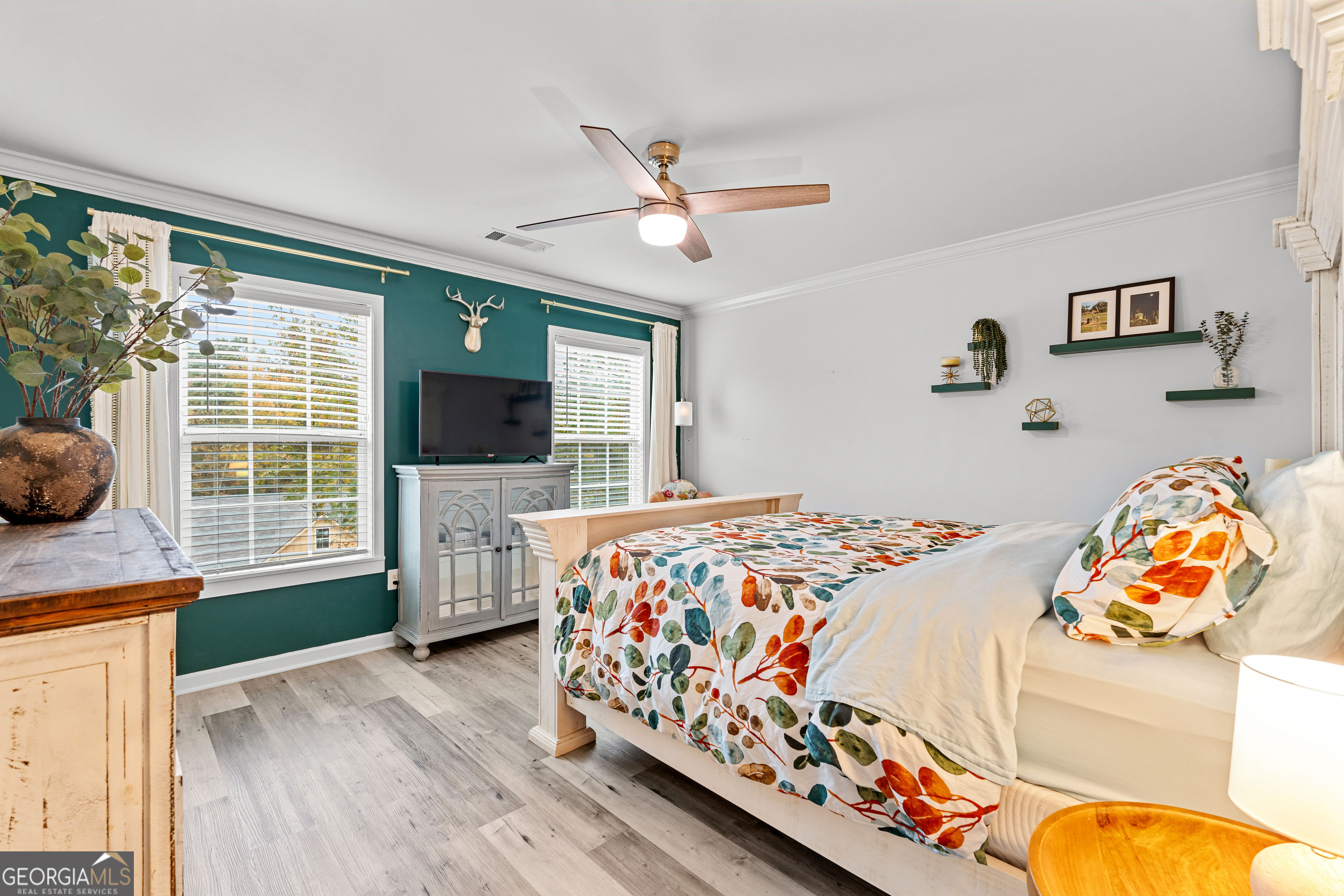 91 Rosemary Way Buchanan, GA 30113 - Photo 24 of 38 a bedroom with a bed and wooden floor