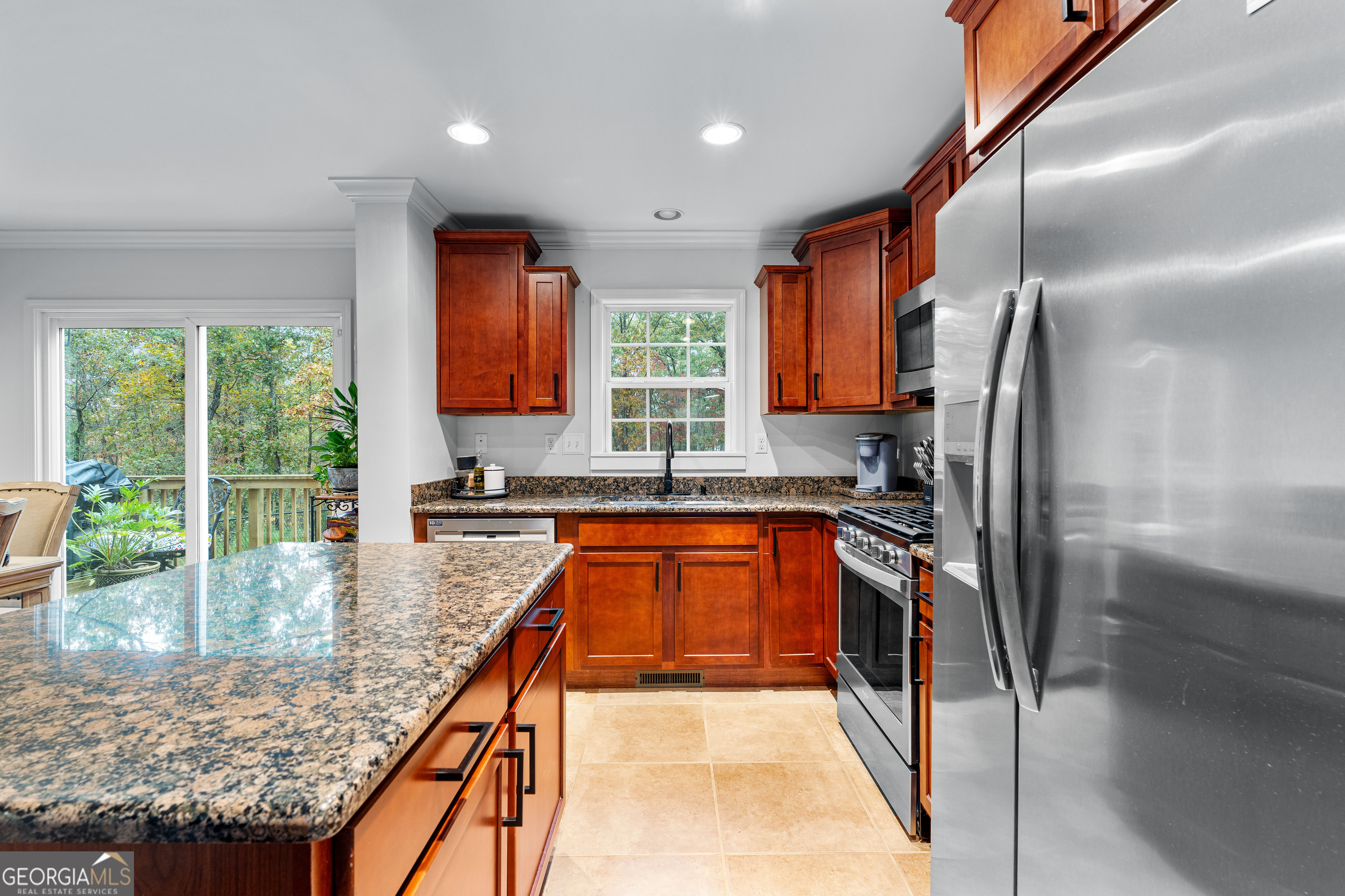 91 Rosemary Way Buchanan, GA 30113 - Photo 7 of 38 a kitchen with stainless steel appliances granite countertop a refrigerator a sink a stove and island