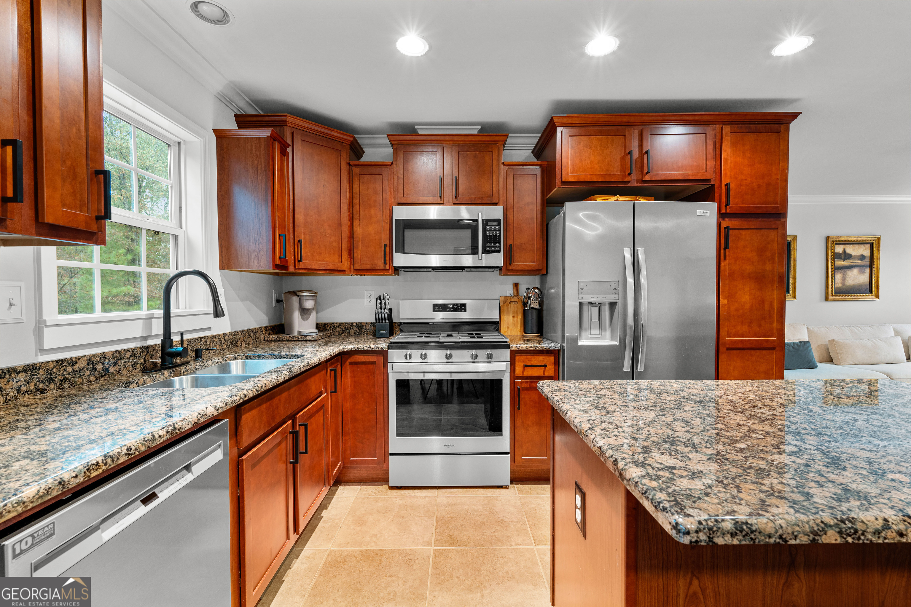 91 Rosemary Way Buchanan, GA 30113 - Photo 8 of 38 a kitchen with stainless steel appliances granite countertop a sink stove and refrigerator