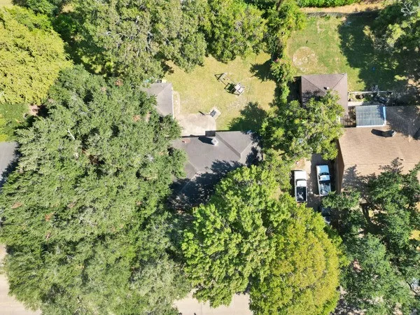 an aerial view of a houses with a lake view