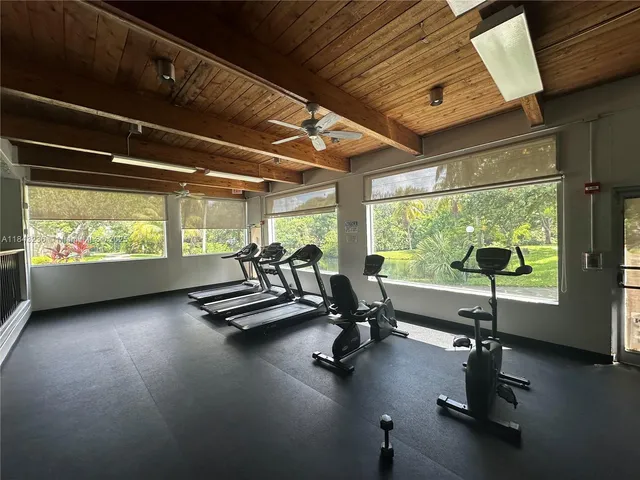 a view of a house with backyard and porch