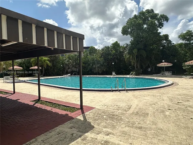 a view of a golf course with a lake