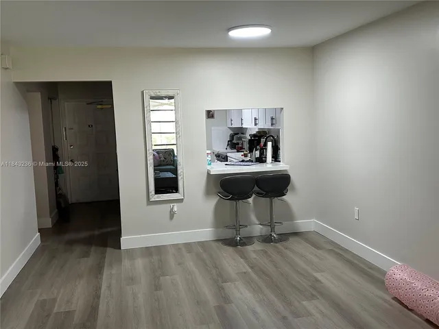 a view of livingroom and hardwood floor