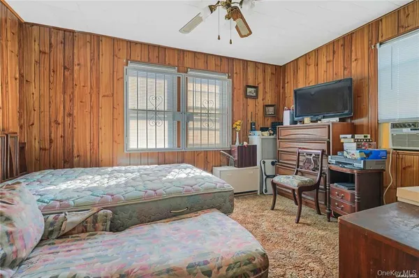 a bedroom with a bed and furniture