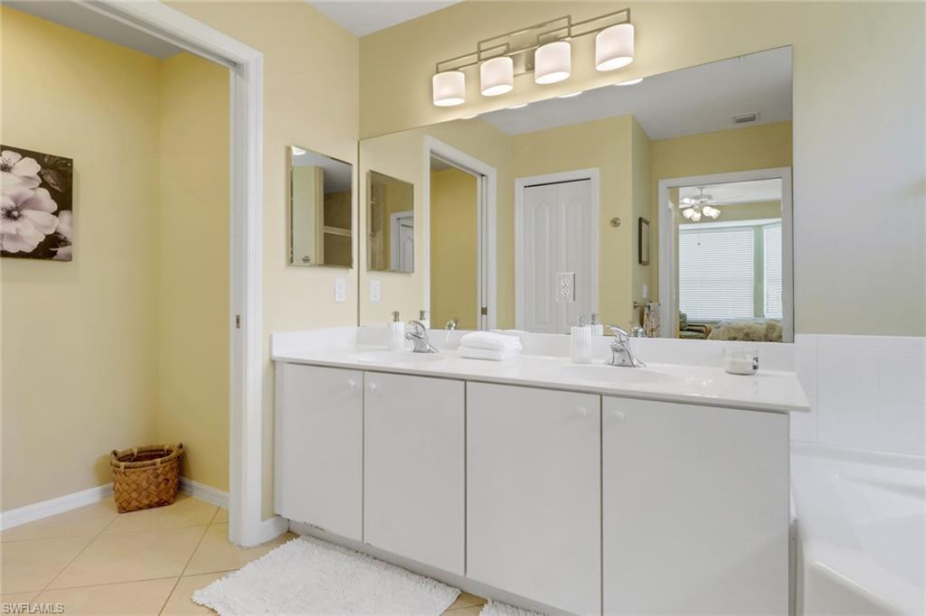 3715 Buttonwood Way, Unit 1711 Naples, FL 34112 - Photo 21 of 40 Dual sinks, separate water closet, linen closet