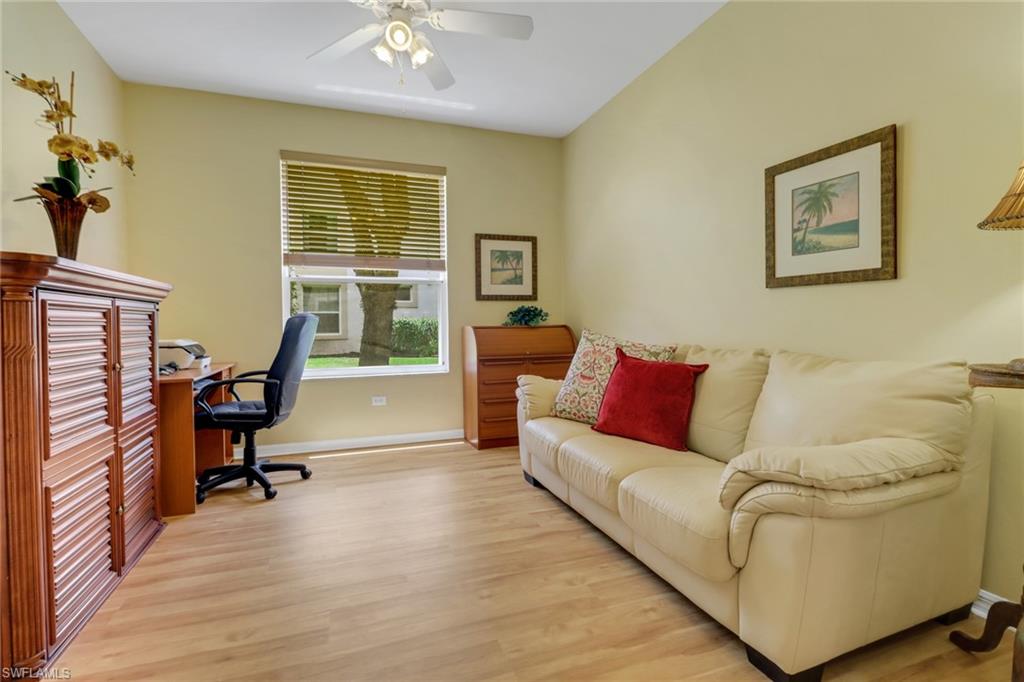 3715 Buttonwood Way, Unit 1711 Naples, FL 34112 - Photo 23 of 40 Den with laminate flooring, large south facing window, sleeper sofa