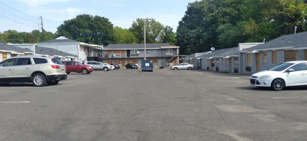 a view of a cars parked in front of a house