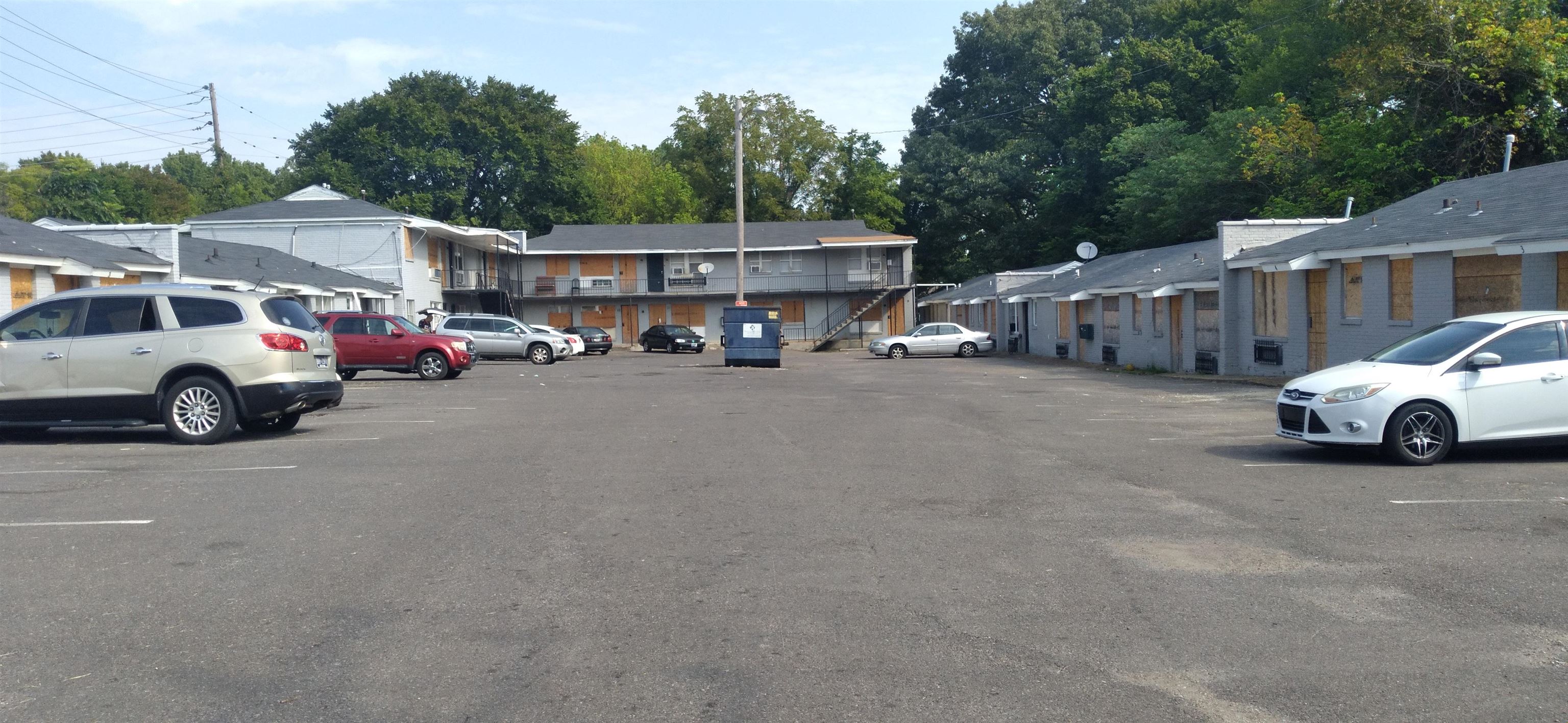 a view of a cars parked in front of a house