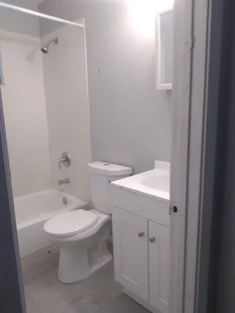 a bathroom with a window and a yard