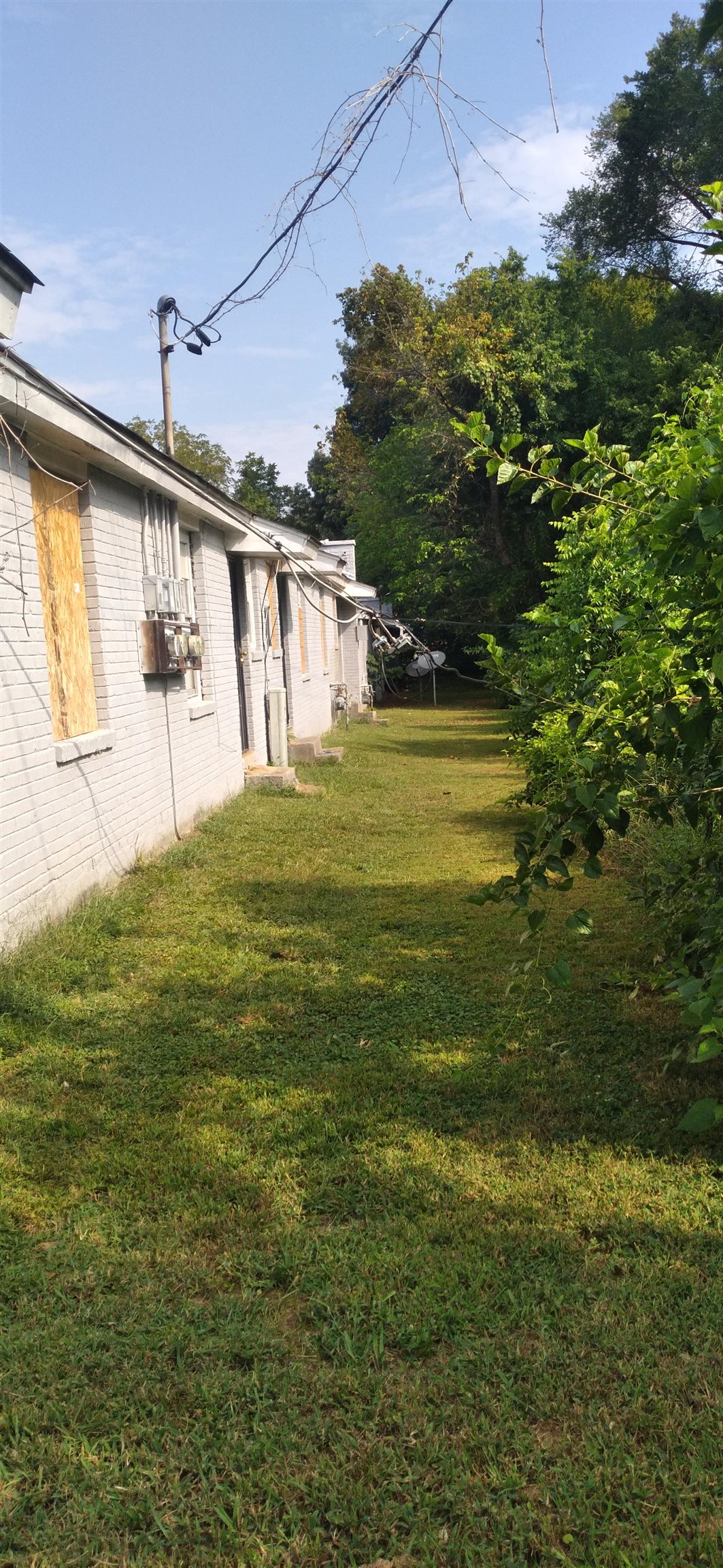 Undisclosed Address Memphis, TN 38108 - Photo 6 of 8 a bathroom with a window and a yard