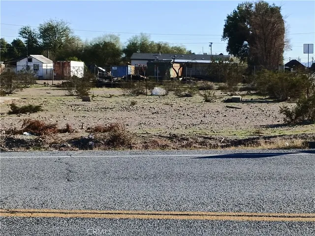 a view of a town with large trees