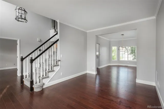 a view of an entryway with wooden floor