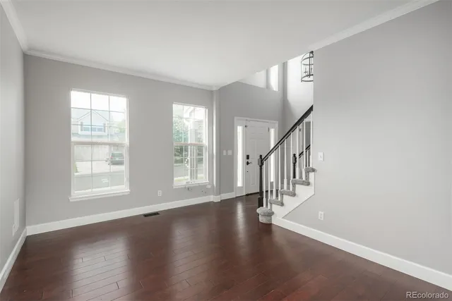 a view of an entryway with wooden floor