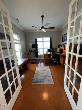 a dining room with furniture a rug and a chandelier