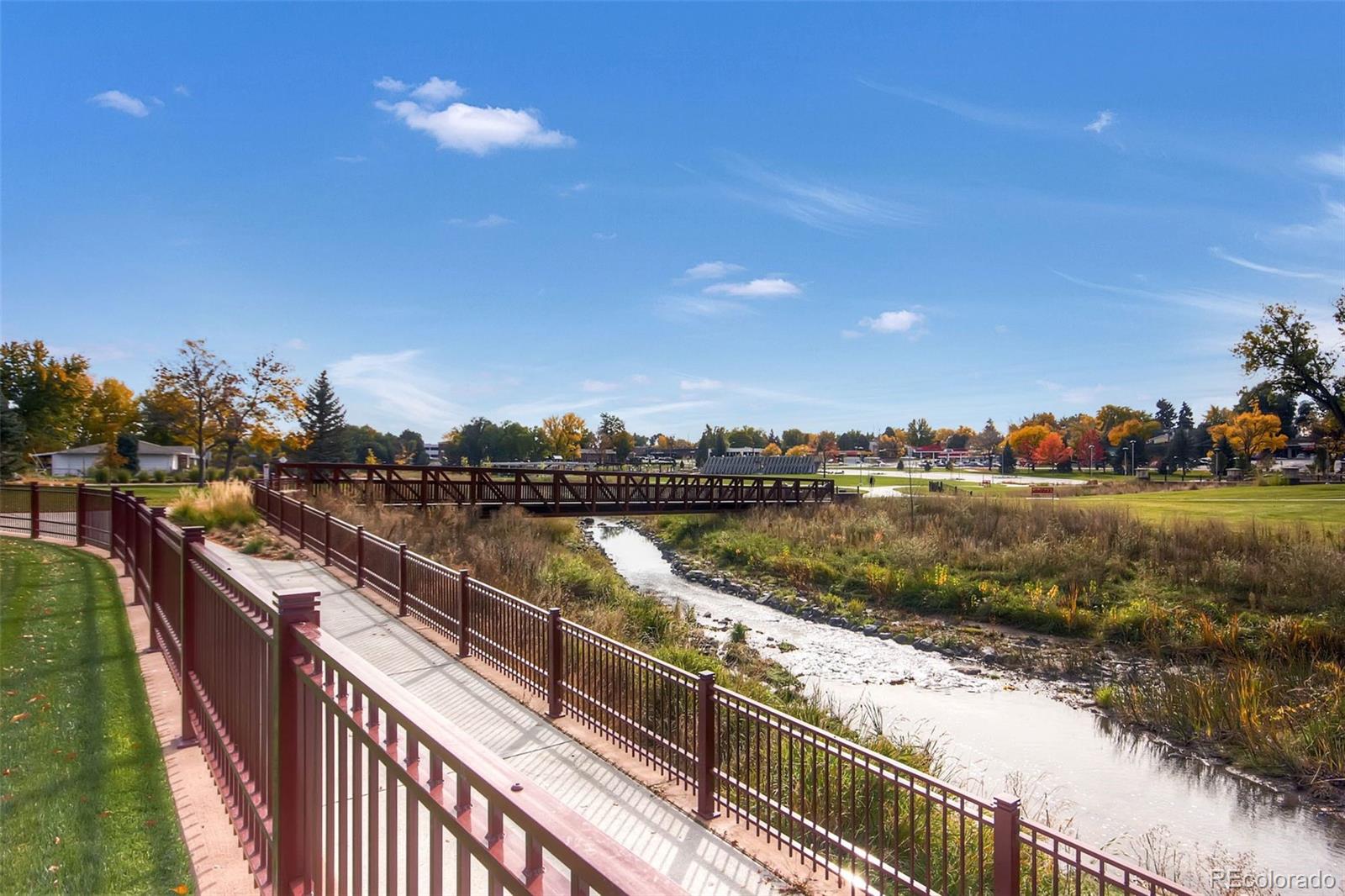 7130 Simms Street, Unit 107 Arvada, CO 80004 - Photo 22 of 29 a view of a lake and outdoor space