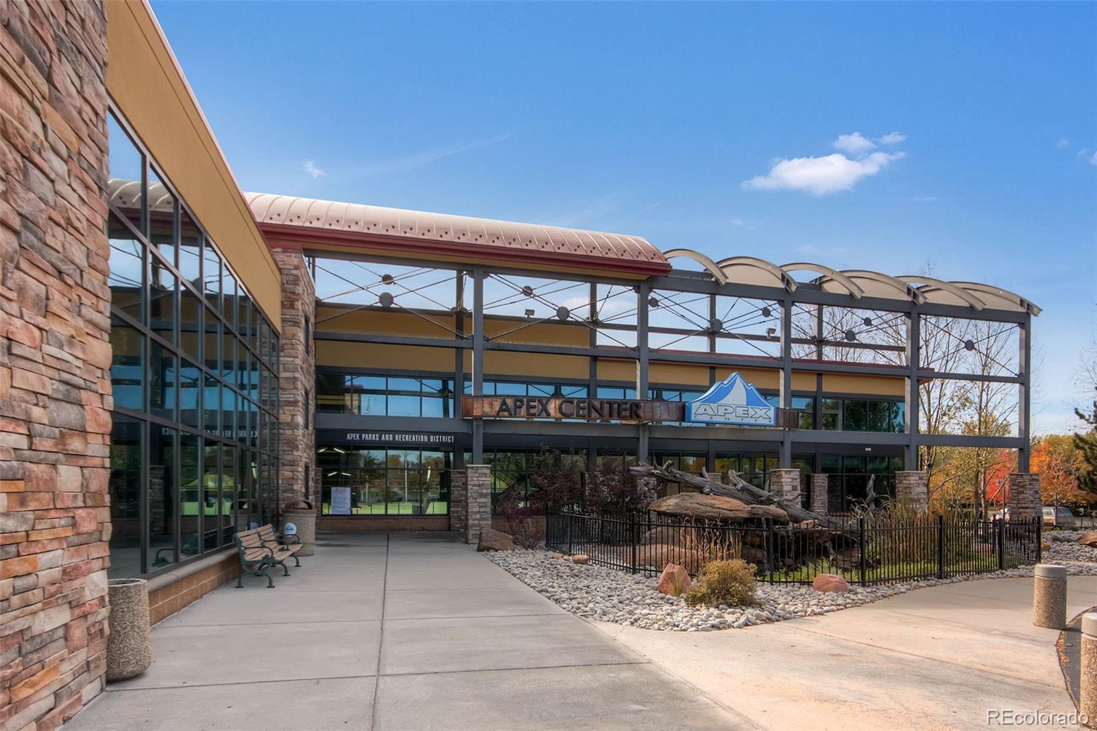 7130 Simms Street, Unit 107 Arvada, CO 80004 - Photo 24 of 29 a view of a building with sitting area