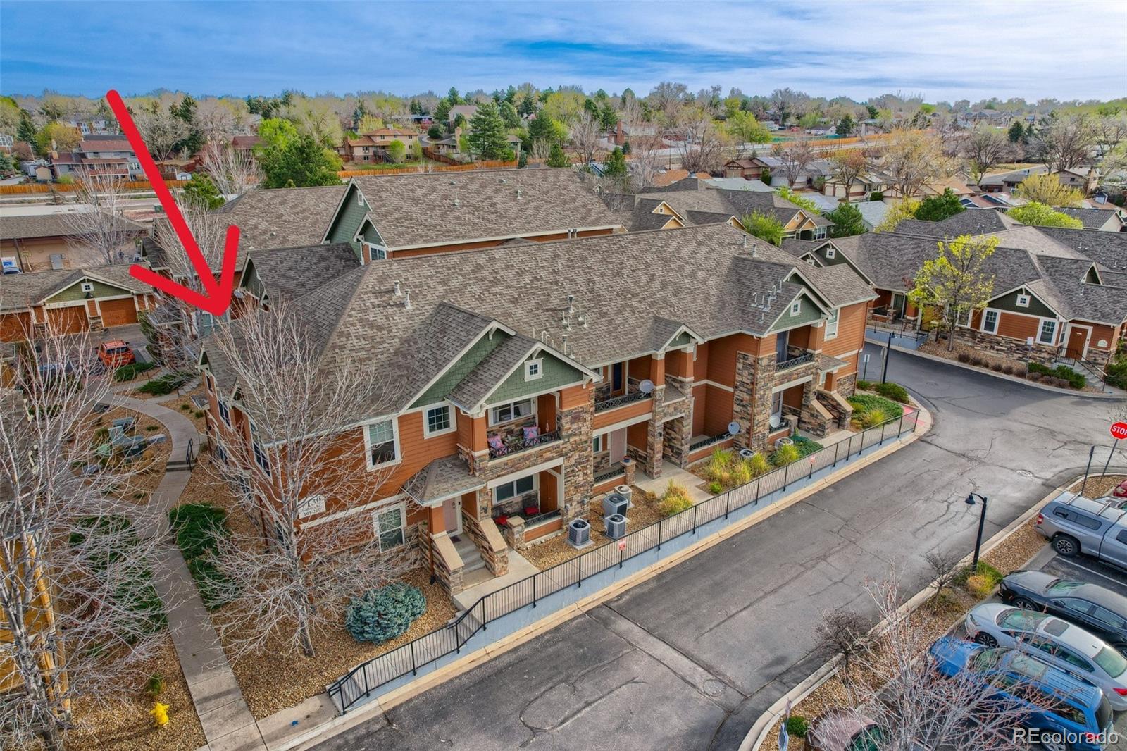 7130 Simms Street, Unit 107 Arvada, CO 80004 - Photo 26 of 29 an aerial view of a house with a yard