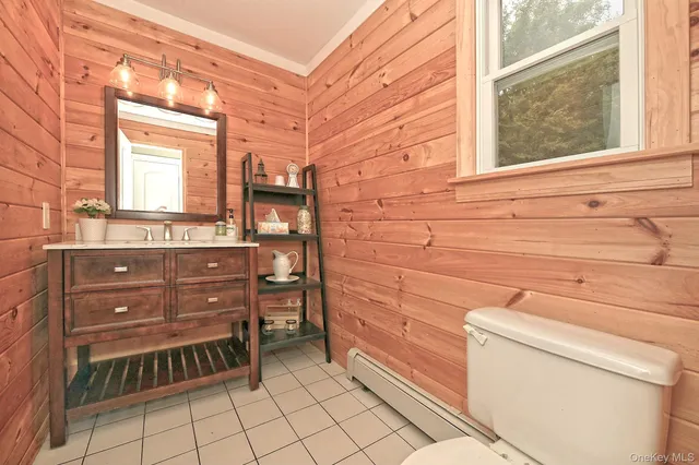 a bathroom with a toilet and a sink