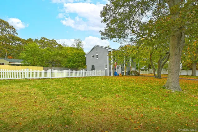 a view of a house with a big yard