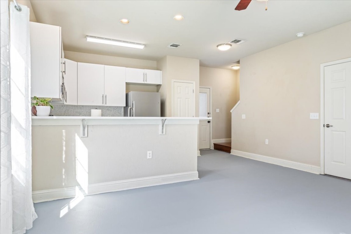 1210 East M. Franklin Avenue, Unit B Austin, TX 78721 - Photo 11 of 32 The dining area sits conveniently between the kitchen and living space, creating an open-concept flow.
