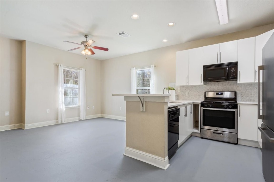 1210 East M. Franklin Avenue, Unit B Austin, TX 78721 - Photo 12 of 31 Granite countertops offer plenty of prep space and a sleek, durable surface.