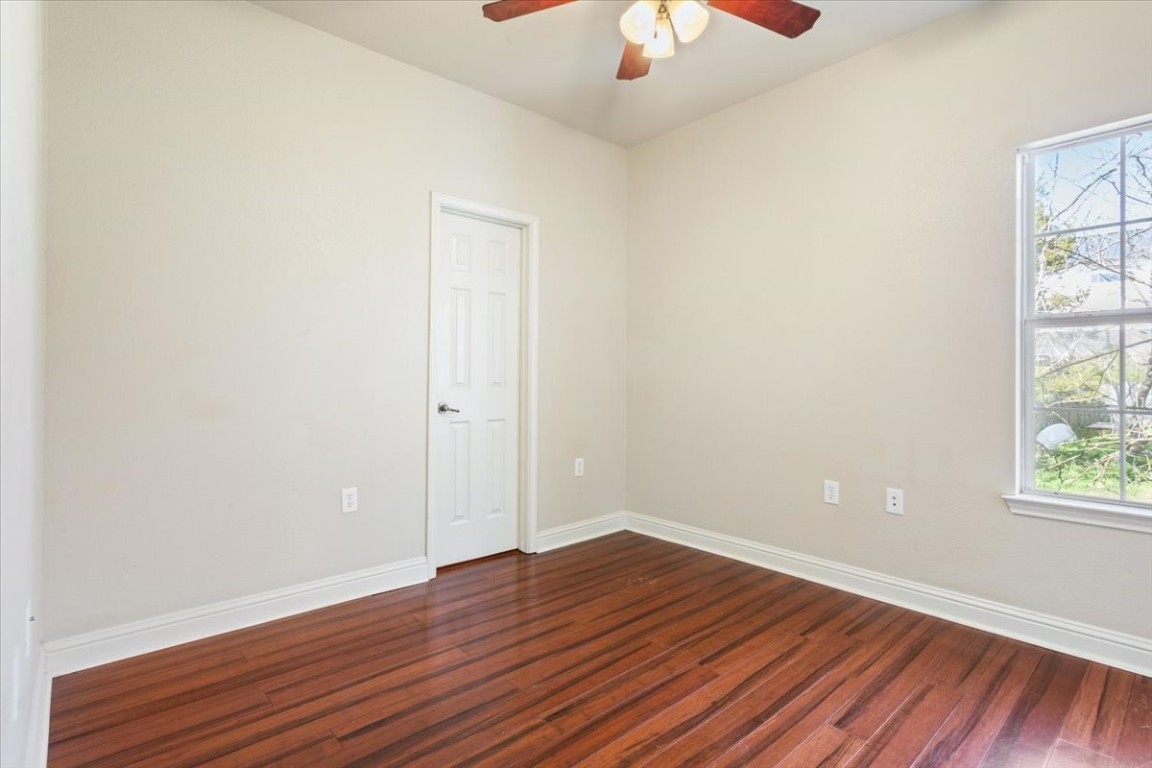 1210 East M. Franklin Avenue, Unit B Austin, TX 78721 - Photo 19 of 31 The secondary bedroom is versatile and inviting, perfect for guests, a roommate, or a home office.