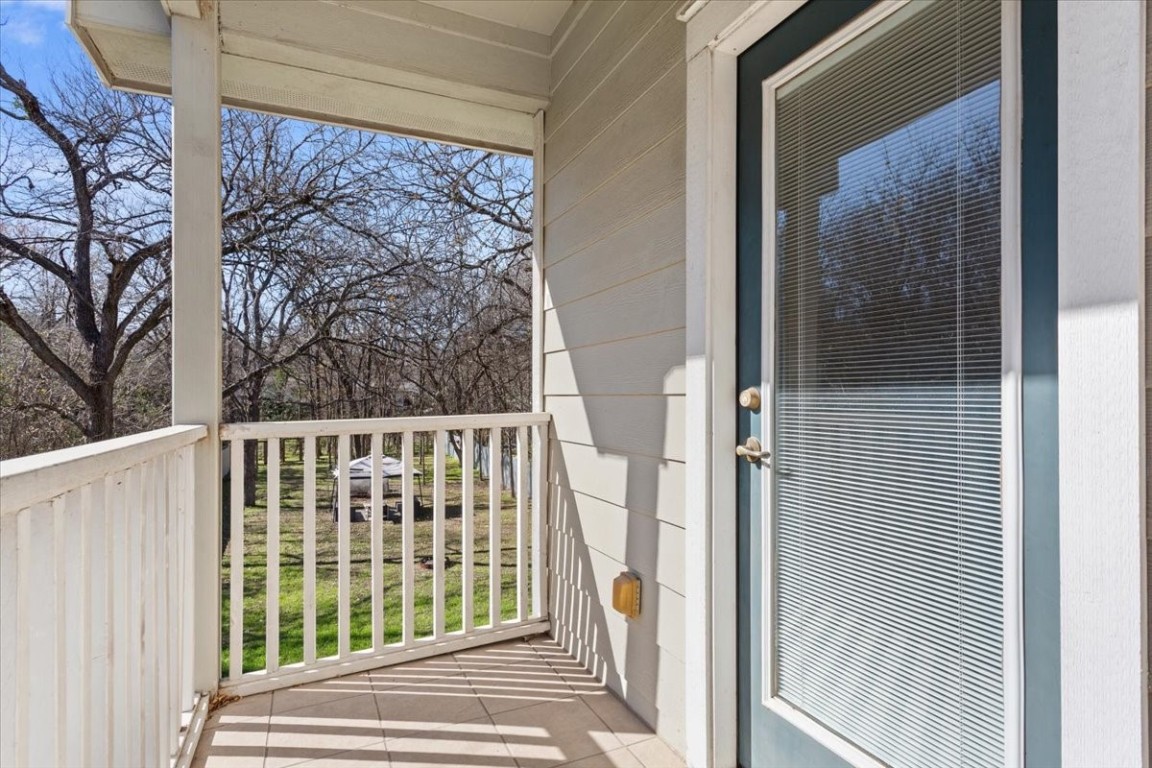 1210 East M. Franklin Avenue, Unit B Austin, TX 78721 - Photo 22 of 32 Step out onto your private balcony and enjoy fresh air with peaceful views of the fenced yard.