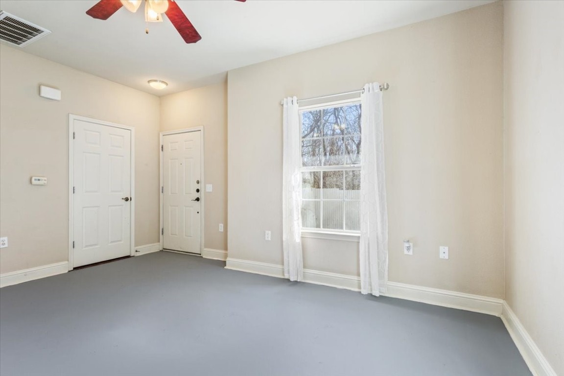 1210 East M. Franklin Avenue, Unit B Austin, TX 78721 - Photo 8 of 32 an empty room with a empty space and windows